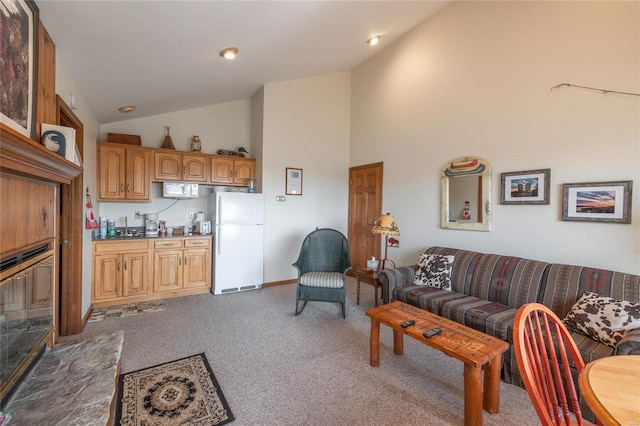 carpeted living room featuring high vaulted ceiling and sink