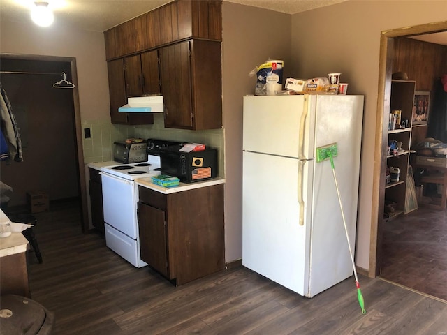 kitchen featuring dark hardwood / wood-style floors, a textured ceiling, backsplash, and white appliances