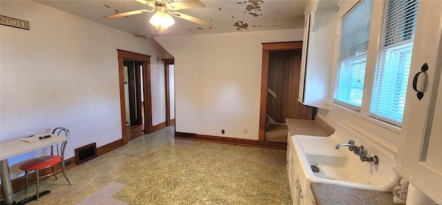 bathroom featuring tile flooring, ceiling fan, and sink