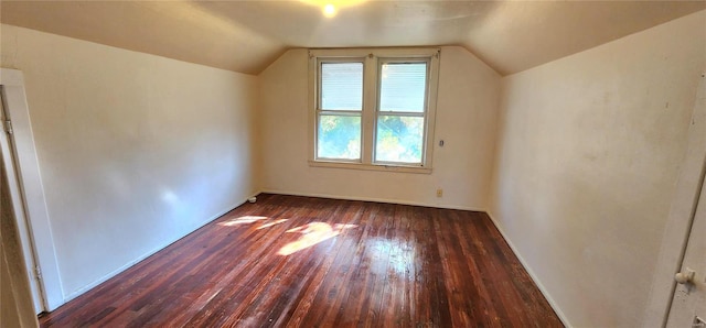 additional living space with lofted ceiling and dark hardwood / wood-style floors