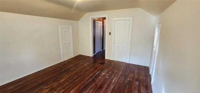 bonus room featuring dark hardwood / wood-style flooring and lofted ceiling