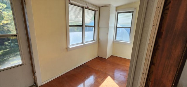 hall with wood-type flooring