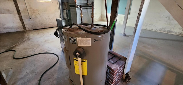 utility room featuring electric water heater