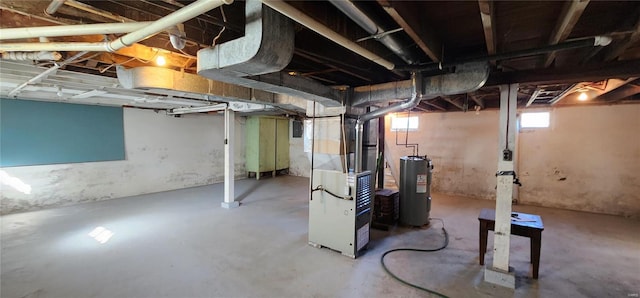 basement with electric water heater and heating utilities