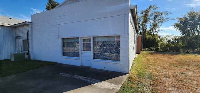 view of home's exterior featuring a lawn