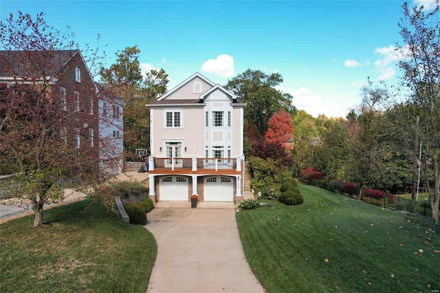 view of front of house with a front yard and a garage