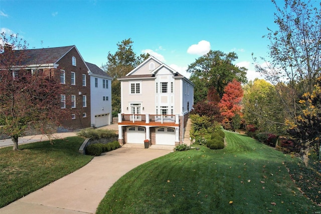 view of front facade featuring a front lawn and a garage