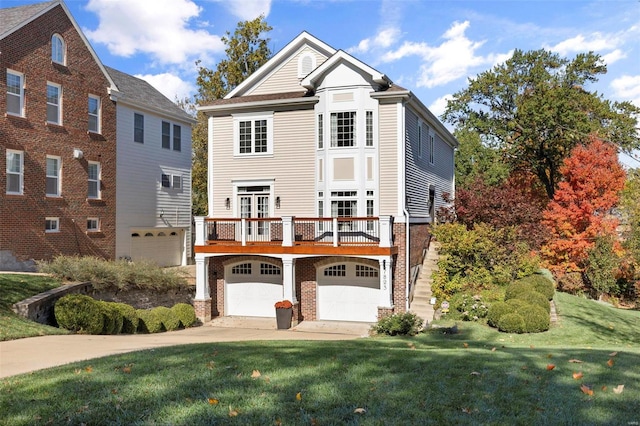 view of front facade with a front lawn and a garage