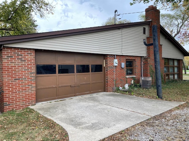 view of front facade with central AC and a garage