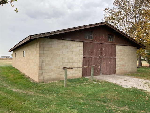 view of side of home featuring a yard