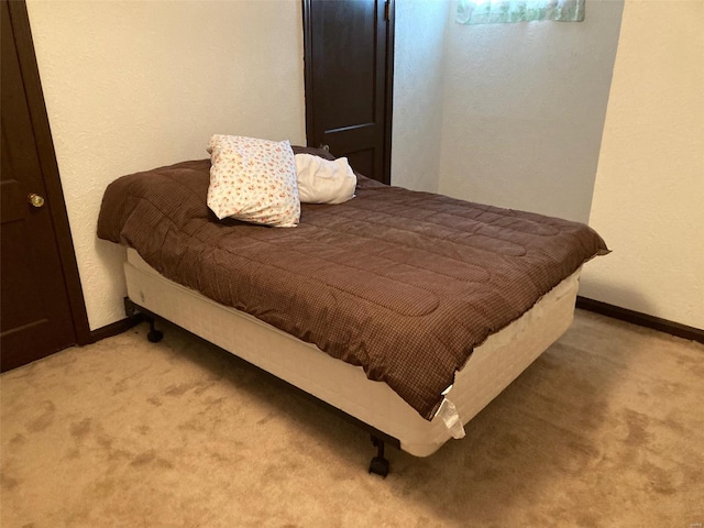 bedroom with light colored carpet