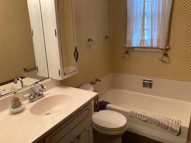 bathroom featuring toilet and large vanity