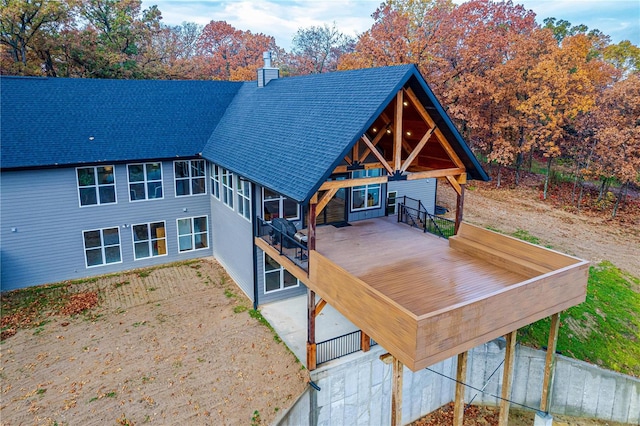 back of property featuring a deck