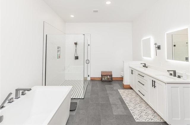 full bathroom featuring toilet, double sink vanity, tile patterned flooring, and shower with separate bathtub