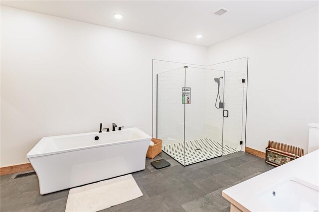 bathroom featuring tile patterned flooring and plus walk in shower