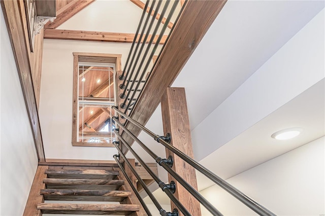 staircase with a high ceiling