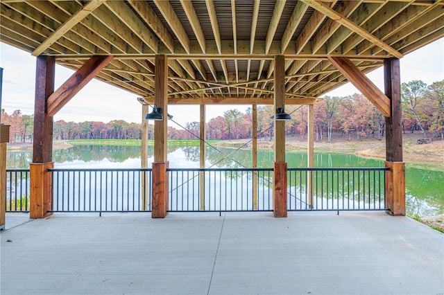 view of patio with a water view