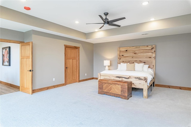 unfurnished bedroom featuring ceiling fan and light colored carpet