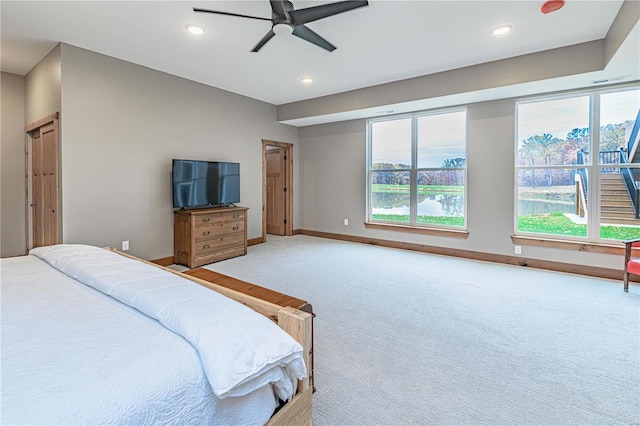 carpeted bedroom featuring ceiling fan