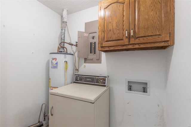 washroom featuring cabinets, washer / dryer, gas water heater, and a textured ceiling