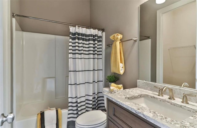 full bathroom with toilet, shower / bath combo with shower curtain, and vanity