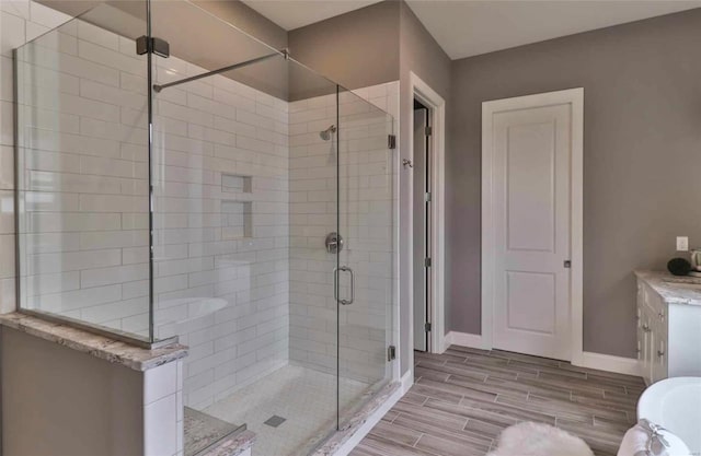 bathroom featuring a shower with door