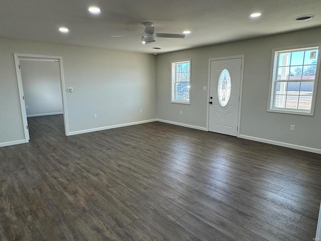 foyer with ceiling fan and dark wood-type flooring