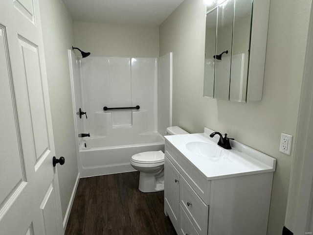 full bathroom featuring oversized vanity, wood-type flooring, toilet, and bathing tub / shower combination