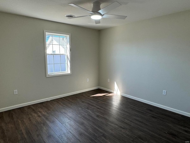 unfurnished room featuring ceiling fan and dark hardwood / wood-style flooring