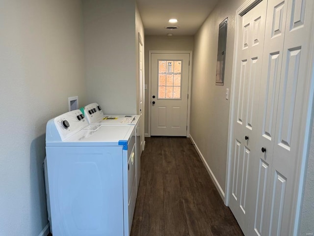 clothes washing area with washer hookup, independent washer and dryer, and dark hardwood / wood-style floors