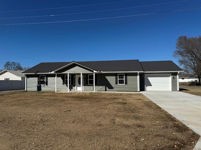 single story home with covered porch and a garage