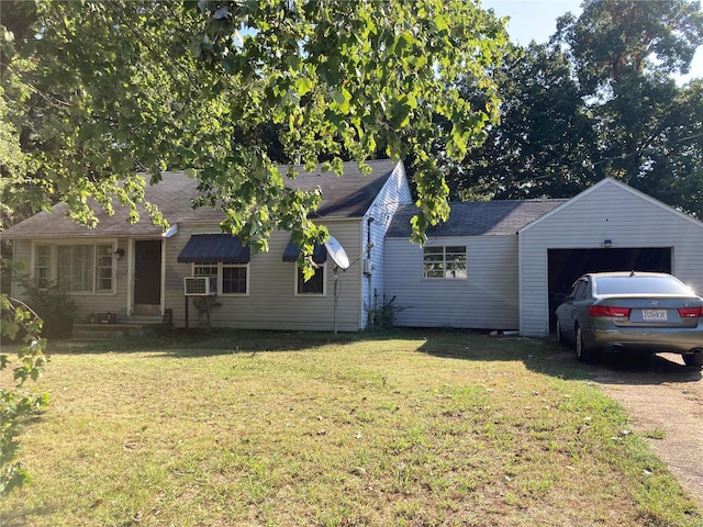 single story home with cooling unit, a front lawn, and a garage