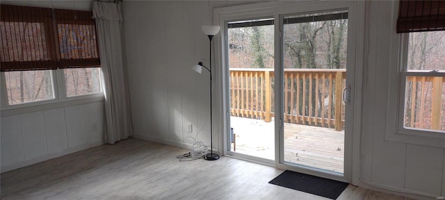 doorway to outside with plenty of natural light and light wood-type flooring