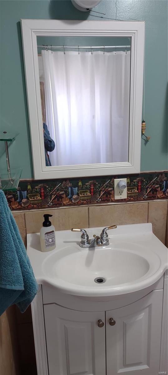 bathroom featuring vanity with extensive cabinet space