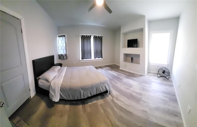 bedroom with hardwood / wood-style floors and ceiling fan