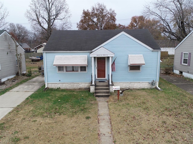 bungalow-style house with a front yard