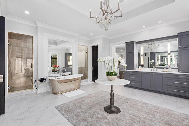 bathroom with independent shower and bath, vanity, an inviting chandelier, and ornamental molding