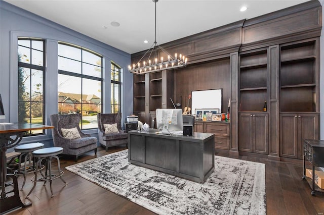 office space featuring dark hardwood / wood-style floors and a notable chandelier