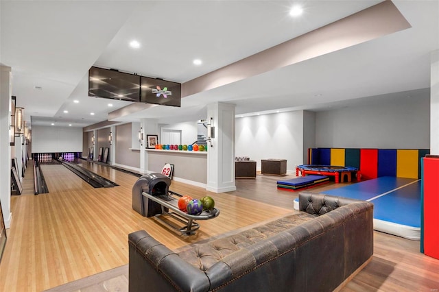 interior space featuring bowling and light hardwood / wood-style floors