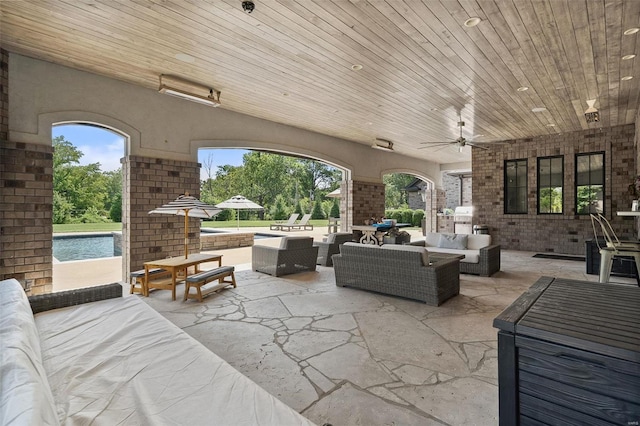 view of patio with outdoor lounge area and ceiling fan