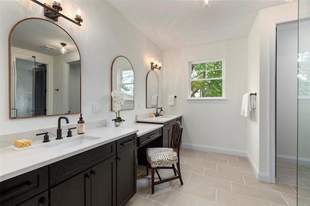 bathroom with vanity and tile patterned floors