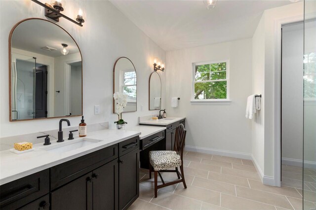 bathroom with tile patterned flooring and vanity