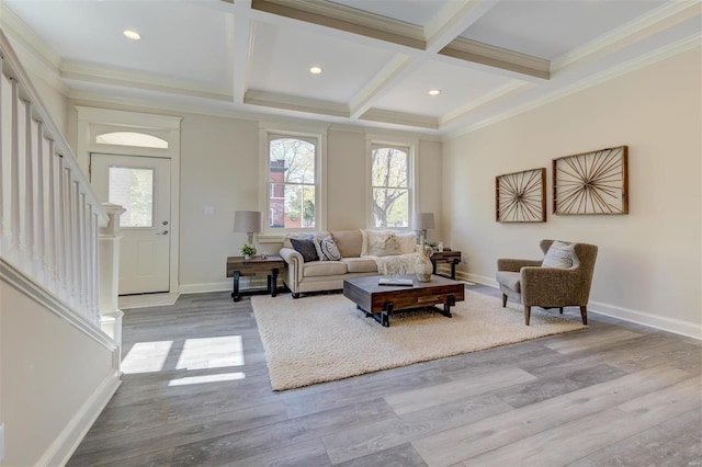 living room featuring beam ceiling, crown molding, coffered ceiling, and wood-type flooring