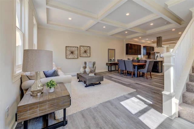 living room featuring beam ceiling, light hardwood / wood-style floors, and coffered ceiling