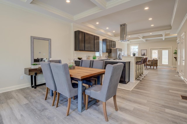 dining room with beam ceiling, coffered ceiling, and light hardwood / wood-style flooring