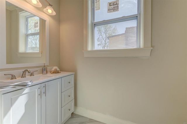 bathroom with tile floors and vanity