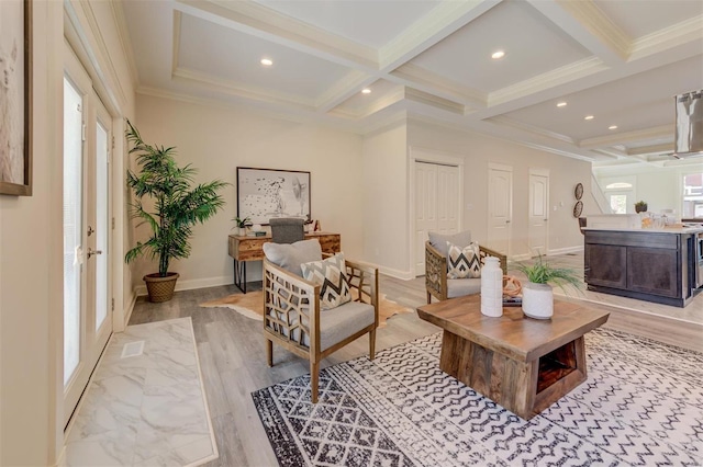 living area featuring crown molding, coffered ceiling, beam ceiling, and hardwood / wood-style floors