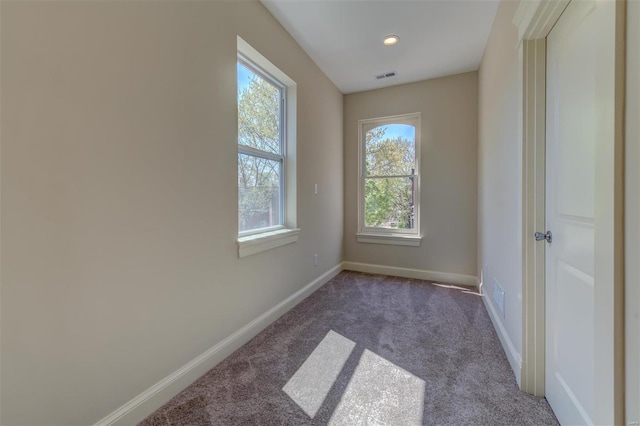 empty room with carpet flooring