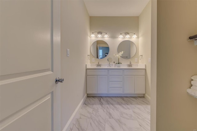 bathroom featuring tile flooring, double sink, and vanity with extensive cabinet space