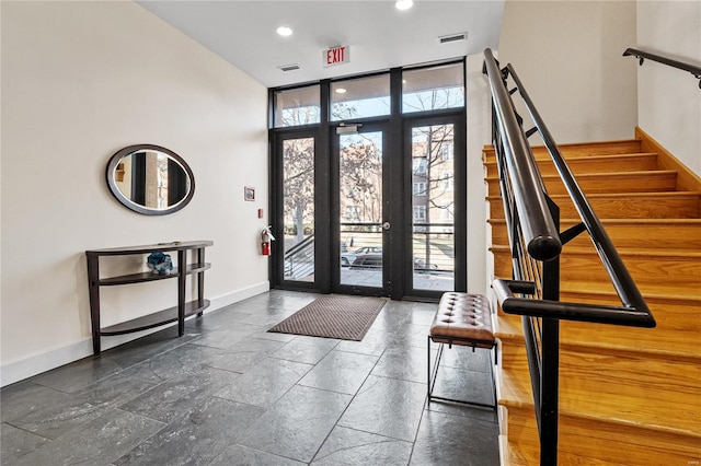 foyer entrance with floor to ceiling windows